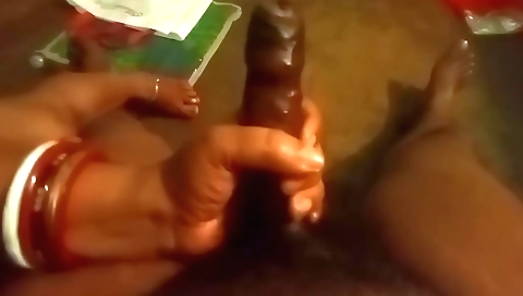 Hot milf with a sexy and horny body is giving a handjob