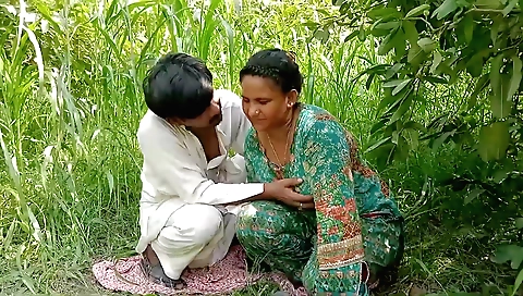 Busty woman with a nice body plays with a cock outdoors
