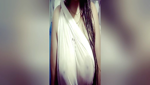 Indian brunette with big tits is playing with her hair