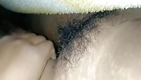 Hairy Indian MILF is having a great time in her village