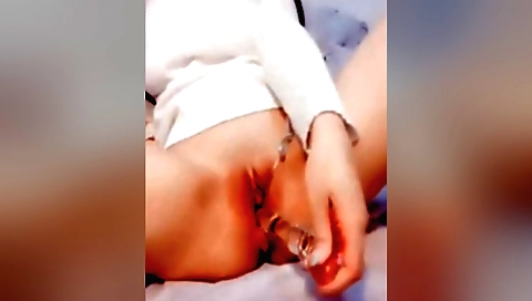 Horny brunette masturbates in bed in homemade porn