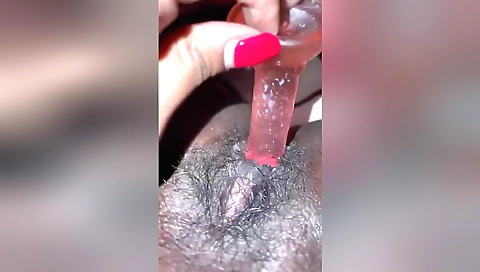 Indian girl masturbates herself on the bed with a toy