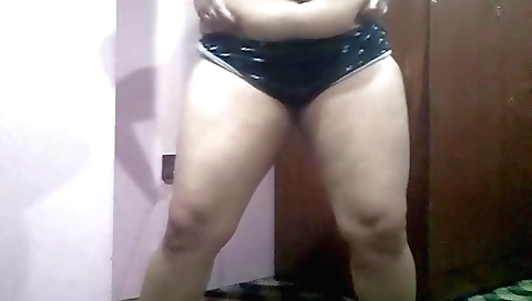 Busty Asian chick masturbating in bed in a sexy pose